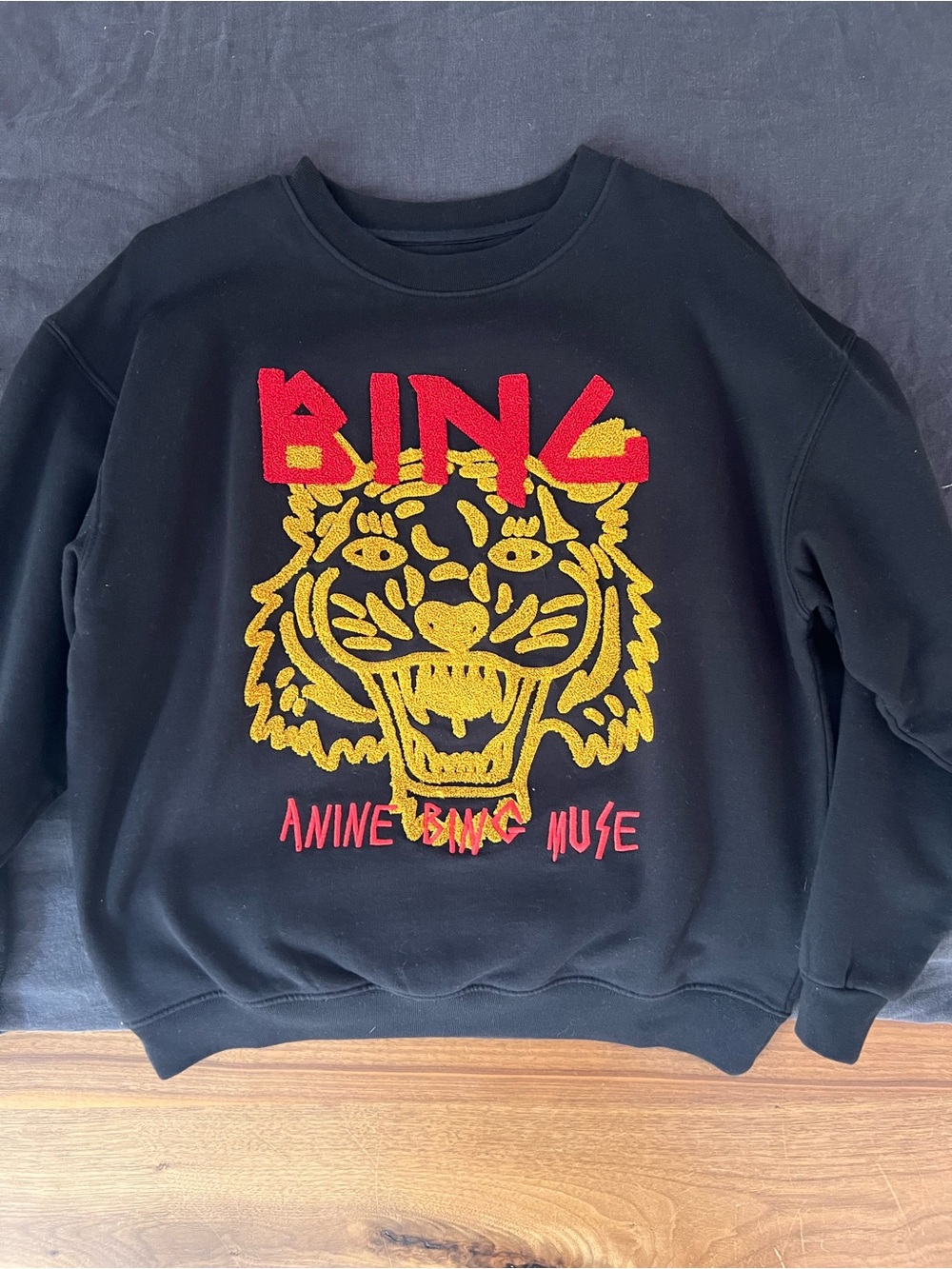 Anine Bing Black Crewneck Sweater with Red Logo & Gold Tiger